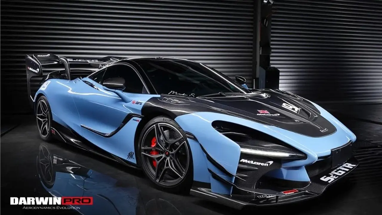 blue bowl of black bean beef tortilla soup on a board with cilantro and shredded cheese in background